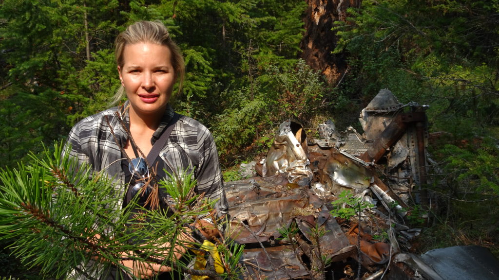 Johanna Wagstaffe, a CBC journalist and private pilot, stands near the wreckage of CP Flight 21 during a recent visit to the crash site. CBC Photo