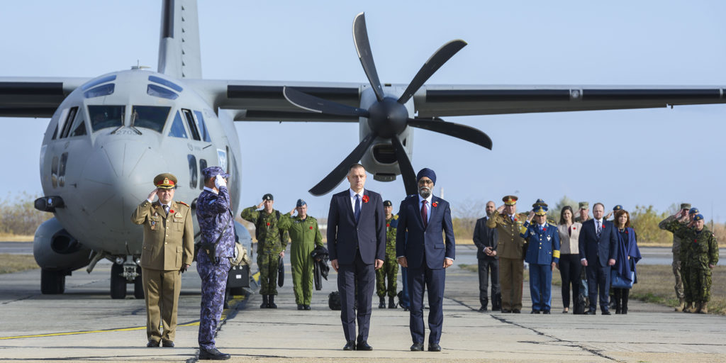 Canada's Minister of National Defence Harjit S. Sajjan (right) and Romania's Minister of National Defense Mihai Fifor receive a salute at Mihail Kogalniceanu Air Base in Romania as part of Operation Reassurance on Nov. 9, 2018. Cpl Dominic Duchesne-Beaulieu Photo