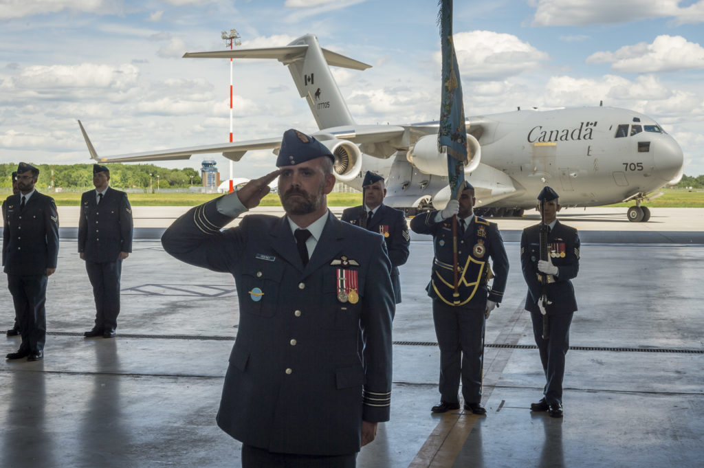 Commanding officer of 429 Transport Squadron, LCol Adam Pentney, takes the salute during the Squadron's change of command parade at 8 Wing Trenton, Ontario. RCAF Photo