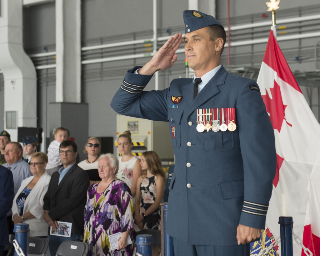 LCol Brandon Sing, the new Commanding Officer of 2 Air Movements Squadron, takes the salute during the Squadron's change of command parade at 8 Wing Trenton, Ontario on July 8, 2018. RCAF Photo