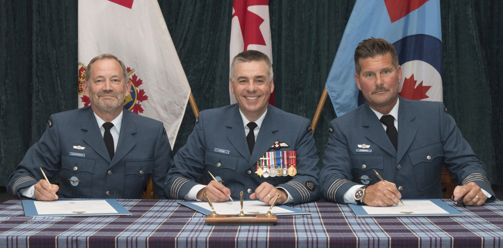 Col Mike Atkins, commander of 19 Wing Comox, British Columbia, presided over an investiture ceremony to welcome the wing's newly-appointed Honorary Col Robert Quartermain. RCAF Photo