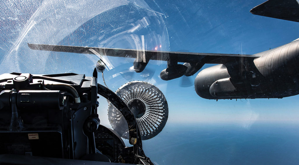 A CF-188 Hornet refuels mid-air from a CC-130T Hercules over the Pacific Ocean during a mission as part of Exercise Puma Strike in 2016. Cpl Manuela Berger Photo