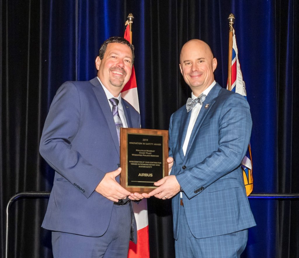 Dwayne Charette, president of Airbus Helicopters Canada, and Rob Duttchen, Winnipeg Police Service administrative sergeant, who accepted the Airbus Innovation in Safety Award on behalf of Malcolm Murray. Heath Moffatt Photo