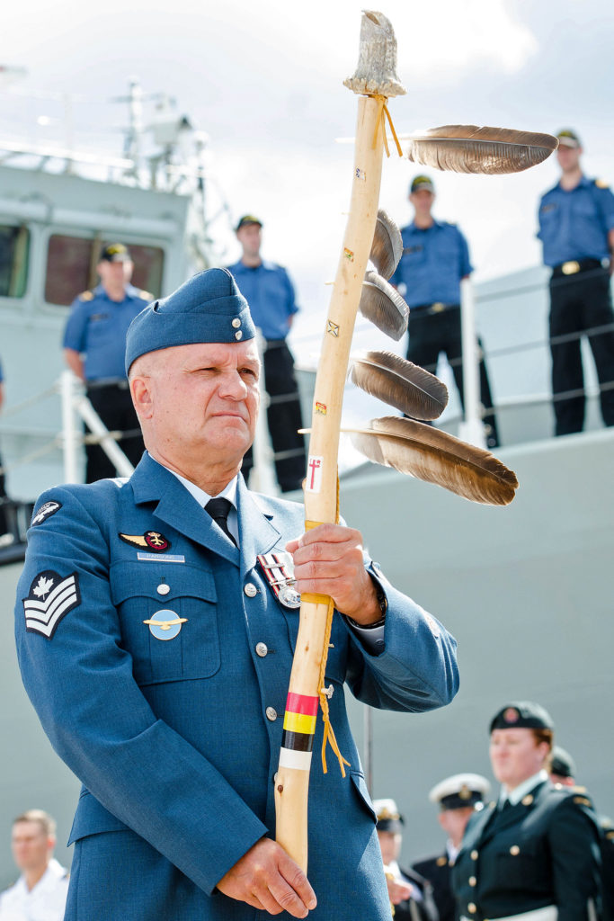 Sgt Parsons carries an Eagle Staff during the change of command ceremony for the commander of the Canadian Fleet Atlantic in Halifax in 2017. Mona Ghiz Photo