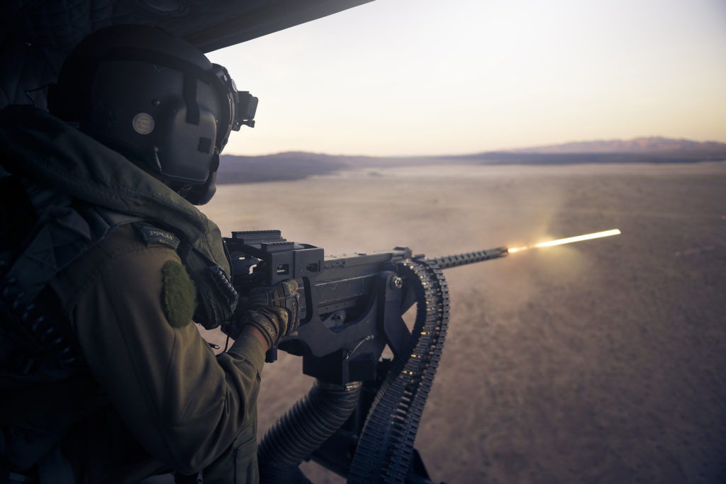 A 408 Squadron door gunner from Princess Patricia's Canadian Light Infantry fires a GAU-21 .50 caliber machine gun from the door of an RCAF CH-146 Griffon helicopter during an exercise at Marine Corps Air Ground Combat Center Twentynine Palms, Calif. Cpl Desiree T. Bourdon/RCAF Photo