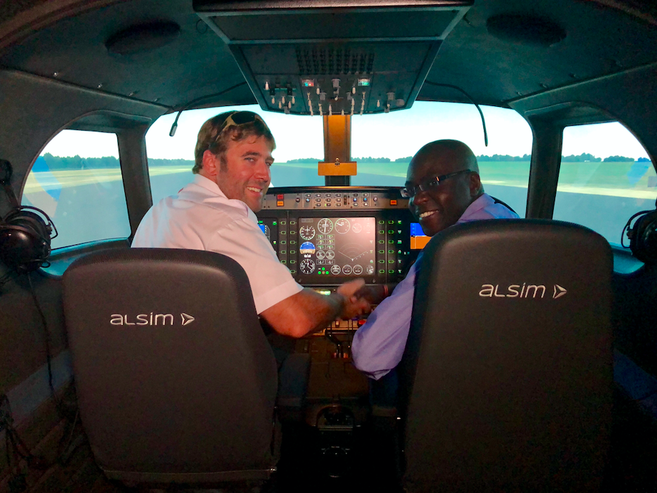 Pat Richardson, left, in Select Aviation College's Alsim ALX simulator. 
