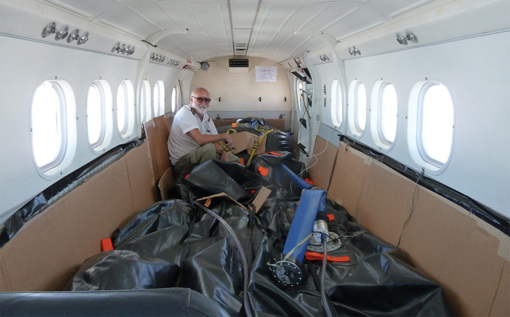 A Twin Otter with full ferry tanks containing an additional 1,000 U.S. gallons can fly for 18 hours. Here, Ambrose investigates a fuel leak in Easter Island.