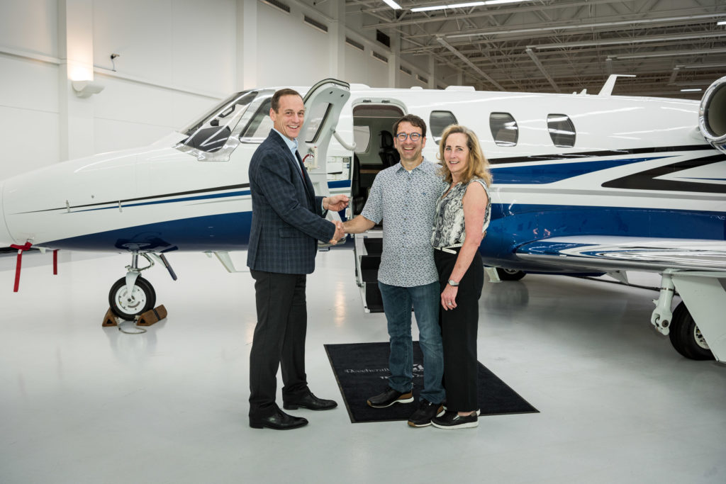 Rob Scholl, left, senior vice-president of Sales at Textron Aviation with the owners of Fast Rabbit Aviation, LLC. Textron Photo