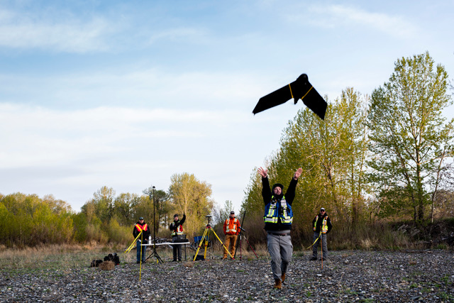 An In-Flight team member launching a drone. In-Flight Data Photo