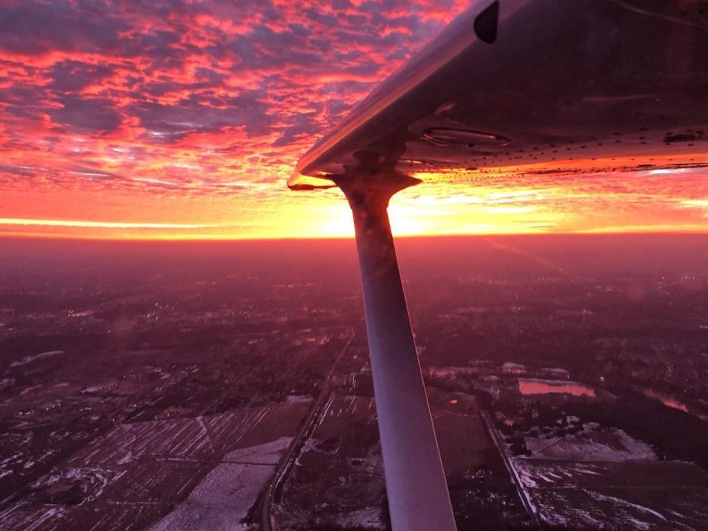 Cessna 172 hovering over a gorgeous sunset at Region of Waterloo International Airport. Photo submitted by Jesse Sharpe (Instagram user @sharpeaero) using #skiesmag