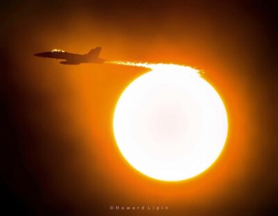 U.S. Navy F/A-18 passing the sun while approaching Naval Air Station North Island, California. Photo submitted by Instagram user @planehowie