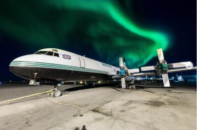 Buffalo Airways Lockheed L-188 Electra resting under the aurora borealis (Yellowknife Airport). Photo submitted by Timo Breidenstein, Instagram user @tb_aviation_photography