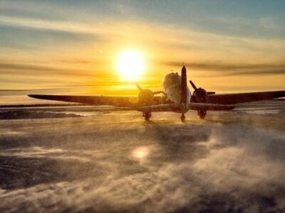 Buffalo Airways Douglas DC-3 departing Yellowknife Airport at sunset (YZF). Photo submitted by Mikey McBryan, Instagram user @mikeymcbryan