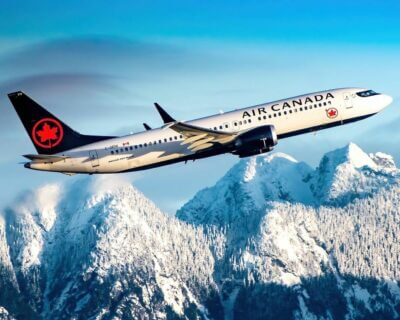 Air Canada Boeing 737 Max 8 sailing past Vancouver’s snow-capped mountains at sunrise (Vancouver International). Photo submitted by Instagram user @dmairplane