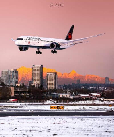 Air Canada 787 Dreamliner arriving at YVR with Vancouver’s mountains illuminated in the background. Photo submitted by Instagram user @yvrspotterdaniel