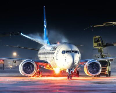 An Air Transat Boeing 737 MAX 8 undergoes a de-icing procedure at Montreal-Trudeau International Airport. Tagged on Instagram by @eg_aviation